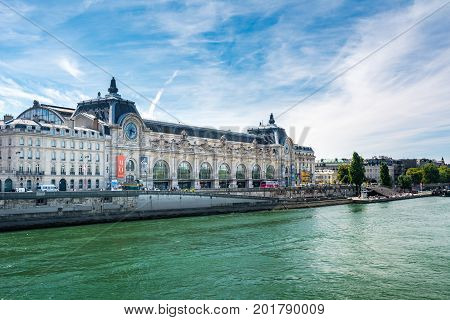 Paris France - August 14 2016: Orsay Museum seen from the right bank of the Seine river. Notice that the museum building was originally a railway station.