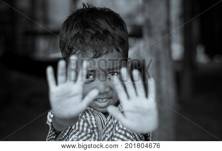 SIEM REAP CAMBODIA - MAY 2 : Closeup face of Unidentified boy of Cambodian in not permit action at kabal spean on May 2 2015 in Siem Reap Cambodia