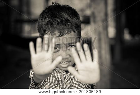 SIEM REAP CAMBODIA - MAY 2 : Closeup face of Unidentified boy of Cambodian in not permit action at kabal spean on May 2 2015 in Siem Reap Cambodia