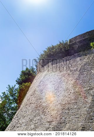 Wall near main entrance to the Stari Grad of Ulcinj Montenegro. The gate of fortress in the Old town in a sunny summer day.