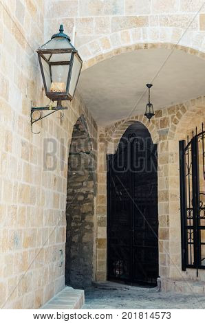 Old narrow street in Stari Grad of Ulcinj Montenegro. The fortress in the Old town in a sunny summer day.