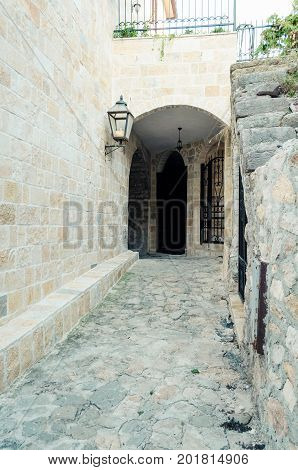 Old narrow street in Stari Grad of Ulcinj Montenegro. The fortress in the Old town in a sunny summer day.