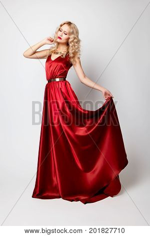 Beautiful Woman Model Posing In Red Dress