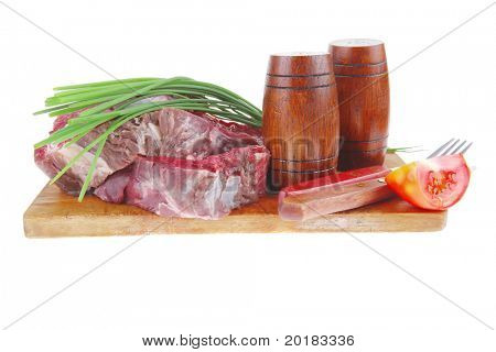 ready to cook: raw beef fillet mignon on cutting board prepared for roasting