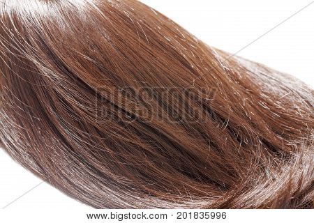 piece of brown hair on white isolated background