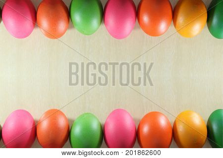 Colorful easter eggs double edge border on marble background with copyspace.