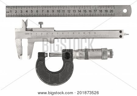 Three old measurement tools - ruler caliper and micrometer on white background