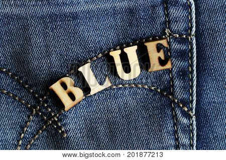 Wooden letters and jeans modern youth fashion