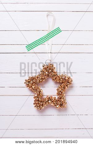 Decorative Christmas star on wooden background. Selective focus. Vertical image.