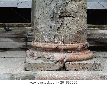 Column. Fragment of old crumbling columns. Architectural background. Column. Architecture.