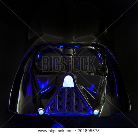 Close up of a Rubies Star Wars Darth Vader Halloween mask with studio lighting