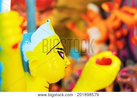 KOLKATA WEST BENGAL INDIA - 25 SEPTEMBER 2016: Clay idol of Goddess Durga under preparation for "Durga Puja' festival in Kumartuli Kolkata. Biggest festival of Hinduism.