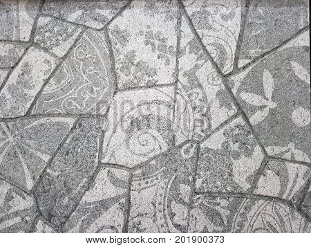 Stone pavement texture. Granite cobblestoned pavement background. Abstract background of old cobblestone pavement close-up. Seamless texture. Perfect tiled on all sides