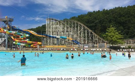 Queensbury. New York - August 2017: Families enjoying summer fun in the amusement park in Queensbury, New York