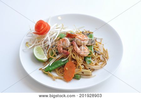 Mi Xao. Lo mein noodles stir-fried with your choice of meat chicken, beef or tofu and mixed vegetables.