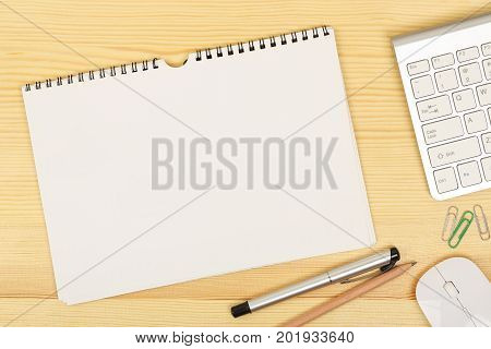 blank spiral notebook on modern office desk