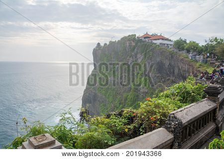 Landscape in Uluwatu Temple Bali Indonesia.
Landscape of high cliff with sunset sky at Uluwatu Temple Bali Indonesia.