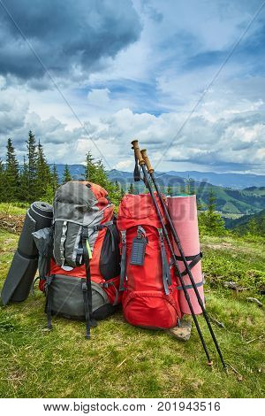 Backpacks in the mountains with views of the mountains.