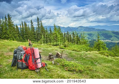 Backpacks in the mountains with views of the mountains.