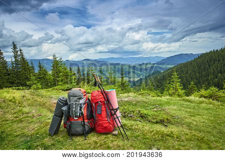 Backpacks in the mountains with views of the mountains.