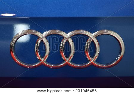 CRACOW POLAND - MAY 20 2017: Audi metallic logo closeup on Audi car displayed at 3rd edition of MOTO SHOW in Cracow Poland. Exhibitors present most interesting aspects of the automotive industry