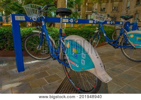PALMA DE MALLORCA, SPAIN - AUGUST 18 2017: Free public rental bikes parked in a rack in Palma de Mallorca, Balearic islands, Spain.