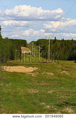 A wide cut line through rural farmland.