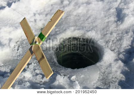 A homemade ice fishing tip up using wood