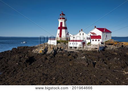 Head Harbor lighthouse guides mariners around the tip of Campobello Island during low tide.