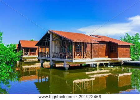Cayo Coco island, Cuba, Iberostar Mojito resort, July 17, 2017, gorgeous, amazing inviting view of hotel grounds with villa houses standing in natural sea water in tropical garden on sunny great day