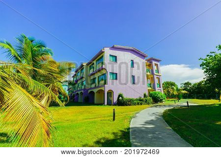 Cayo Coco island, Cuba, Iberostar Mojito resort, July 17, 2017, amazing inviting view of hotel buildings standing in tropical garden on sunny beautiful day