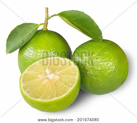 Lime fruit with half and leaves isolated on white background.