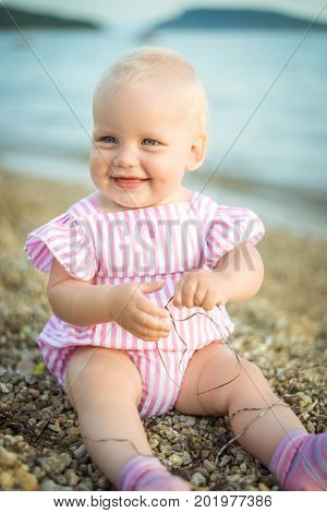 A cute dreamly little baby girl portrait at home