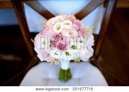 Beautiful wedding colorful bouquet for bride. Beauty of colored flowers. Close-up bunch of florets. Bridal accessories. Female decoration for girl. Details for marriage and for married couple