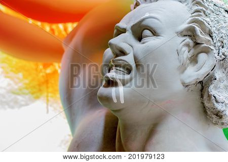 KOLKATA WEST BENGAL INDIA - 25 SEPTEMBER 2016: Artist preparing Clay idol of Asura the demon for 