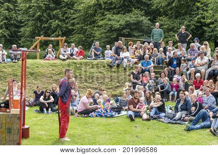 Kids Watching A Theater Show Outdoors
