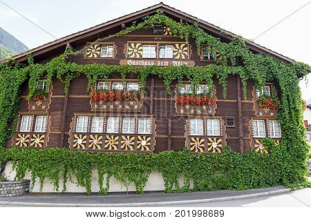 The Typical Chalet At Burglen On The Swiss Alps