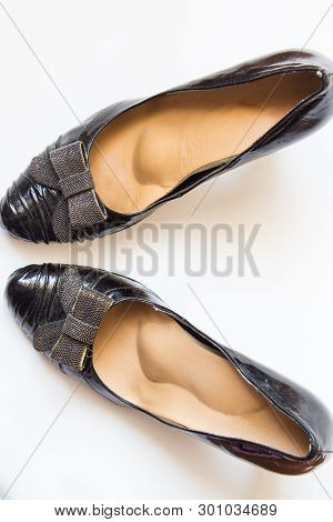 Universal Leather Orthopedic Insoles For Everyday Wear Inside Black Shoes. Top View.