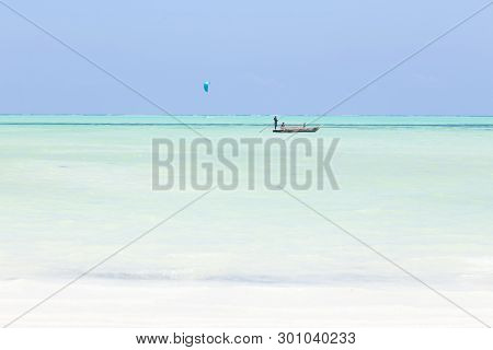 Fishing Boat And A Kite Surfer On Picture Perfect White Sandy Beach With Turquoise Blue Sea, Paje, Z