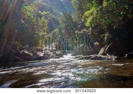 Waterfall Water Flow In Rocks With Green Forests. This Image Is Taken At Marmala Waterfall Vagamon K