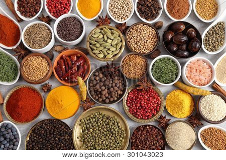 Aromatic Spices And Herbs In Metal And Ceramic Bowls. Top View.