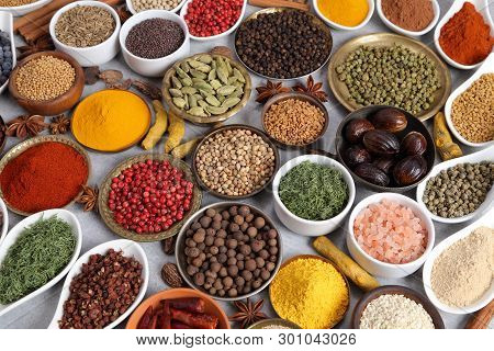 Aromatic Spices And Herbs In Metal And Ceramic Bowls. Top View.