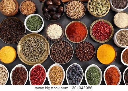Aromatic Spices And Herbs In Metal And Ceramic Bowls. Top View.