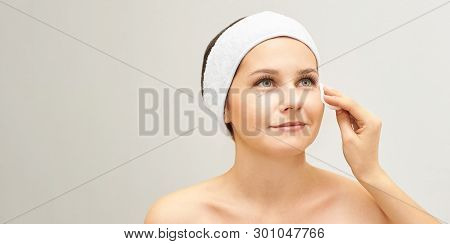 Cosmetology Doctor Remove Mascara From Girl Face. Cotton Pad With Woman Hands. Demakeup Lotion