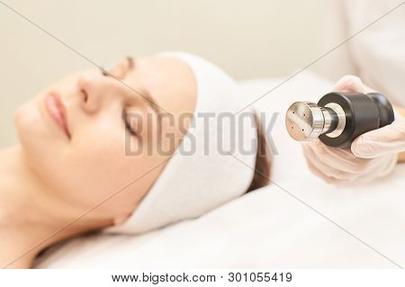 Non Injection Mesotherapy. Doctor And Patient In Clinic. Rejuvenation Cosmetology Tool. Woman Aesthe