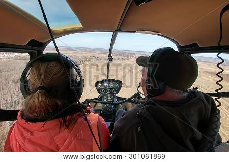 Voskresensk, Russia - May 1, 2019: Men And Woman, Two People Are Flying In The Cockpit Of The Robins
