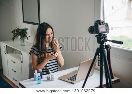 Girl Videoblogger Or Beauty Blogger Records Video For Subscribers. She Smells The Cream And It Smell
