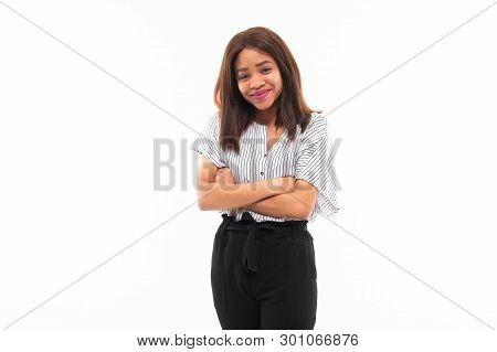 Portrait Of African Young Girl Possing And Gesticulates Hands On Background
