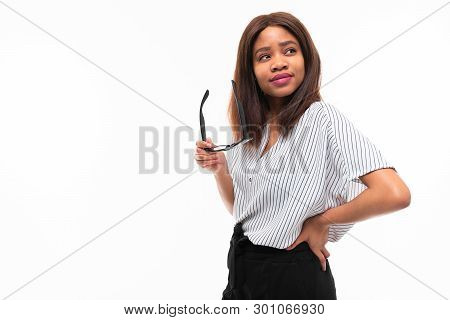 Portrait Of Attractive Young Afro-american Girl Possing With Glasses On Background