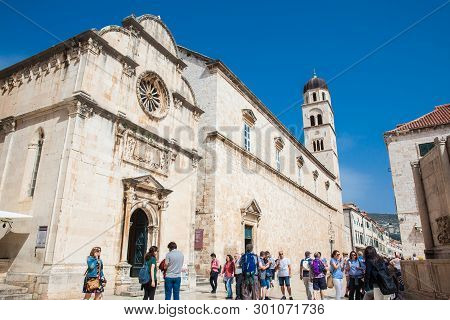 Dubrovnik, Croatia - April, 2018: Tourists At The Church Of St. Spasa Located At Stradun Street In T